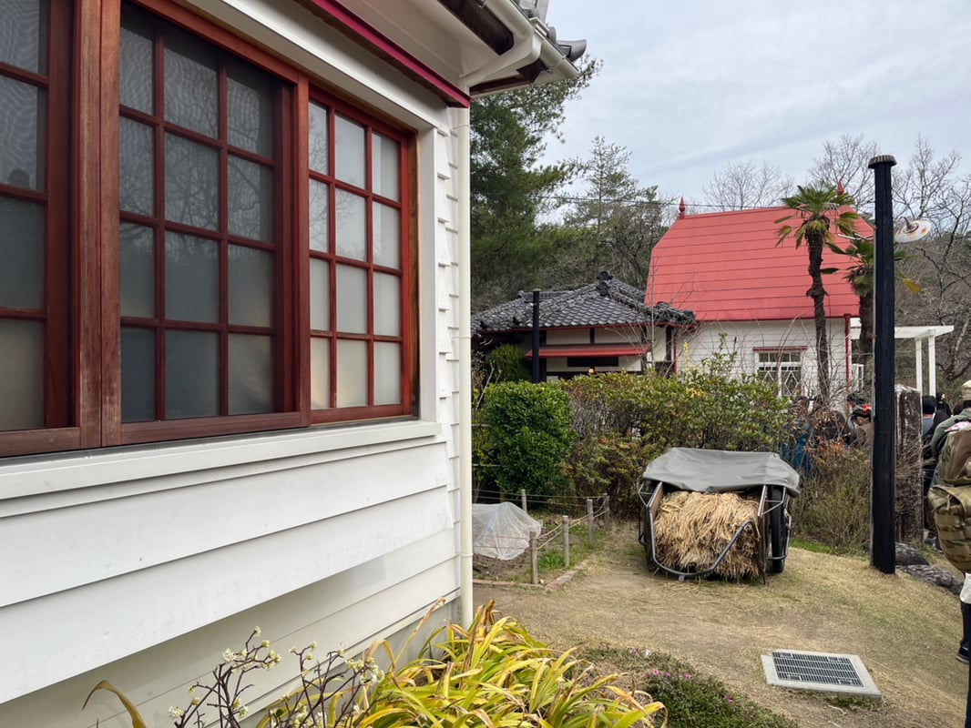 This is an image of a house exterior, showing the yard and facade.