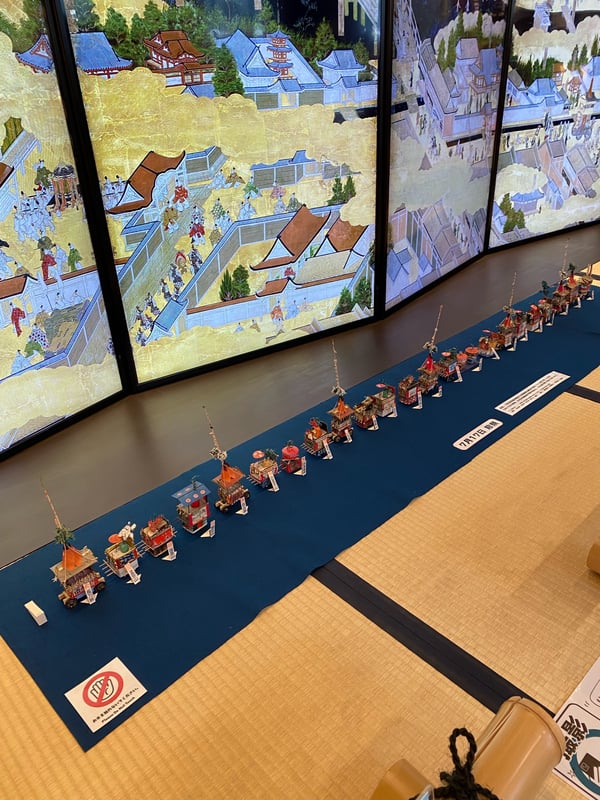 The image depicts a miniature Yama float.