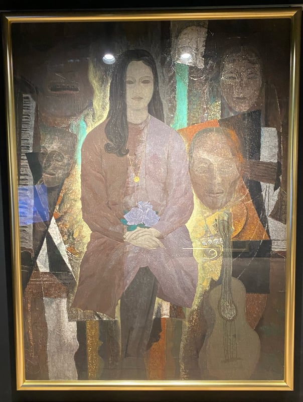 The image depicts a woman holding a beautiful flower surrounded by Noh masks, which represent the emotions of the characters, aiming to illustrate the beauty and ugliness within the human heart.